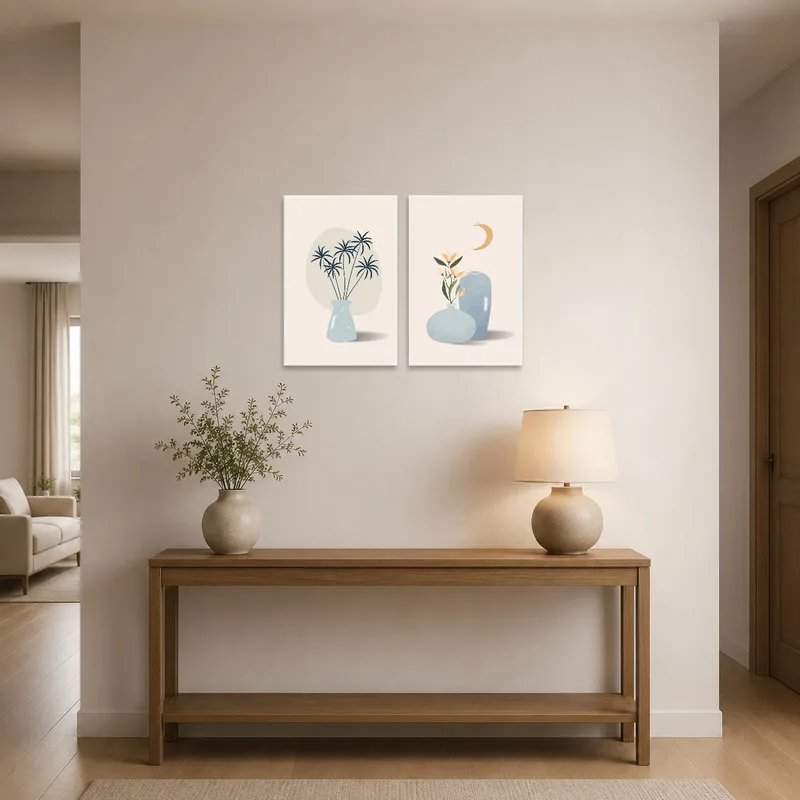 Botanical art prints create a welcoming feel in an entrance hall over a console table.