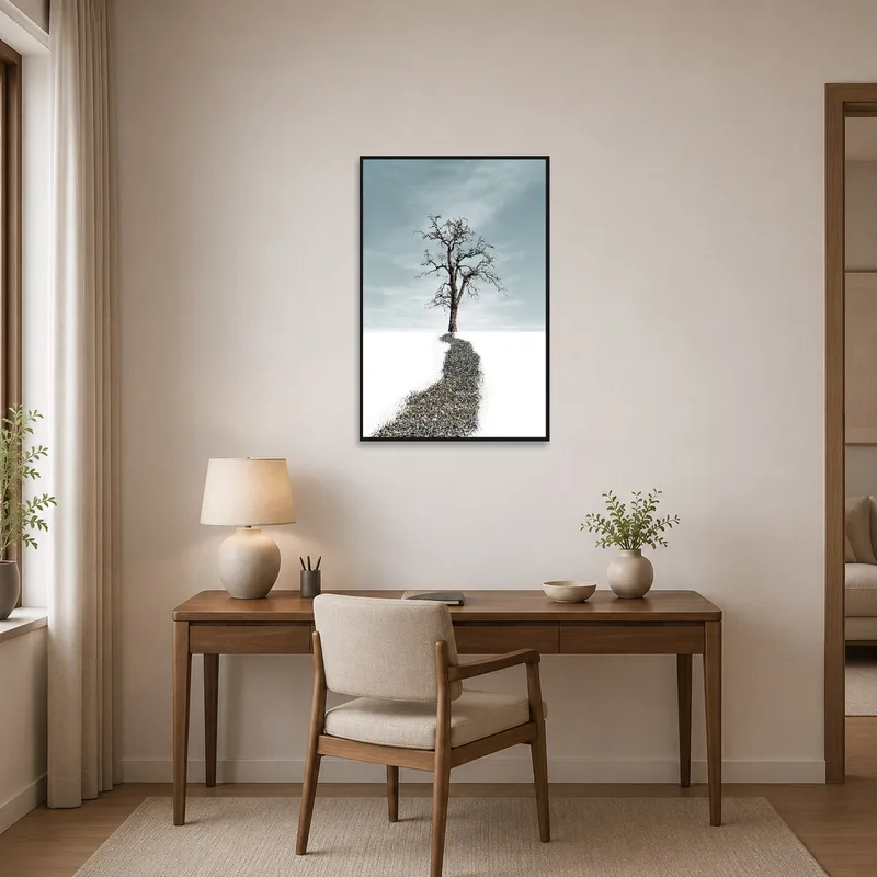 Solitary tree artwork providing inspiration in a tidy home office.