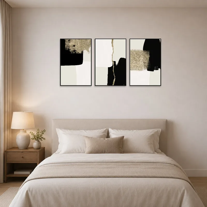 Abstract triptych providing a focal point in a serene bedroom setting.