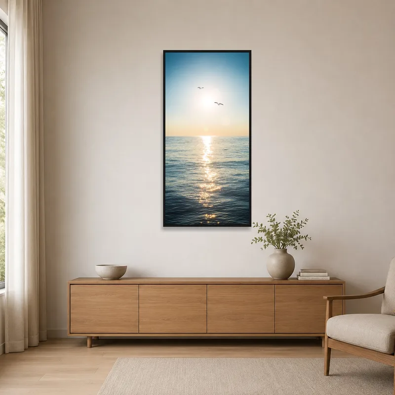 A sunlit ocean horizon with seagulls adding charm to a minimalist room with sleek furnishings.