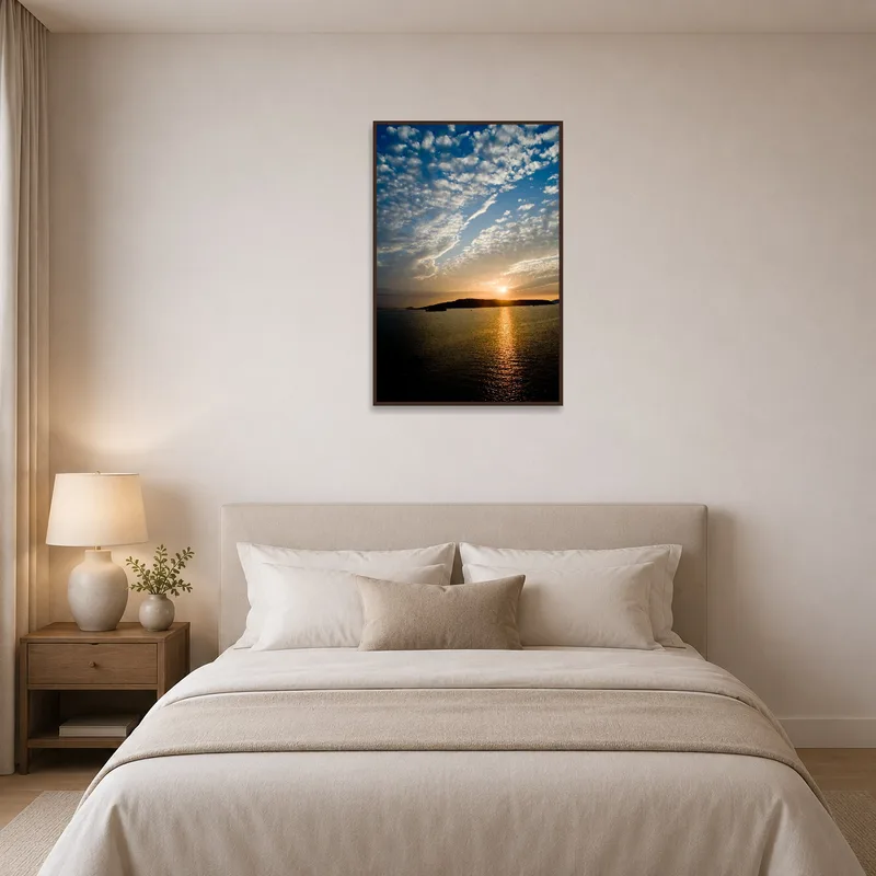 Serene sunset with clouds hung in a calming bedroom.