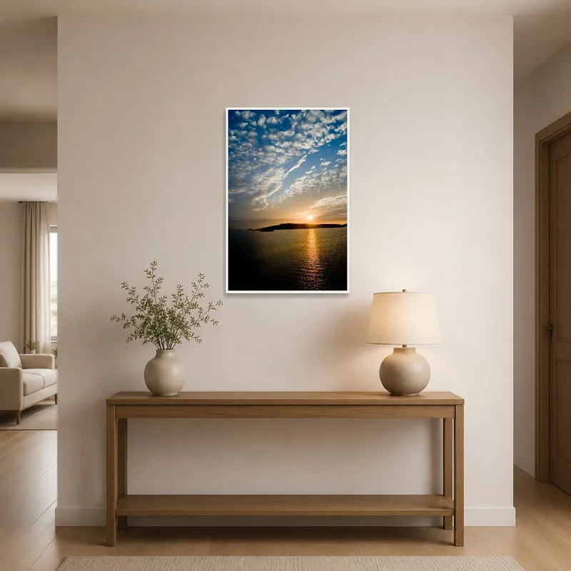 Painting of sunset over tranquil water in an entrance hall.