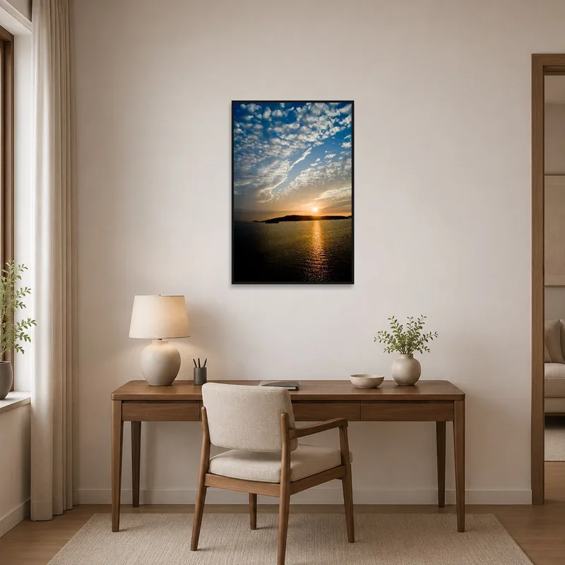 Sunset art with reflections displayed in a tidy home office.