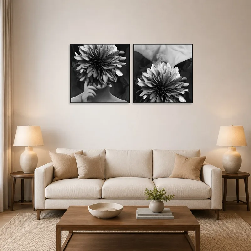 Surreal floral monochrome art set on a living room wall above a modern sofa.