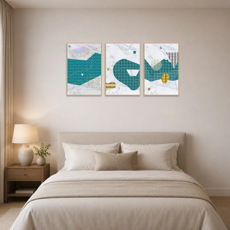 Teal and gold abstract art set brings a modern touch to a bedroom wall.