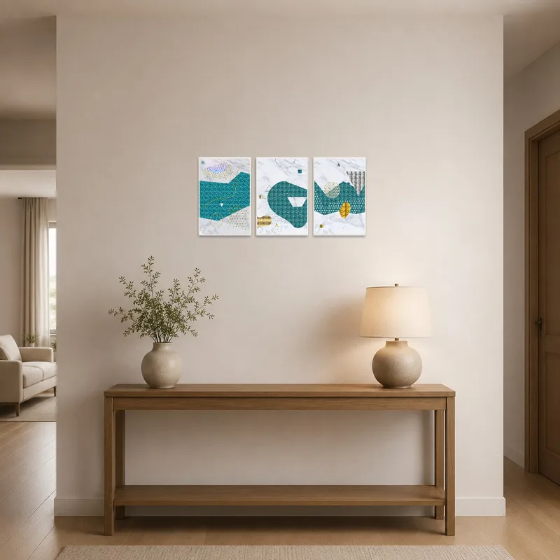 Teal and gold abstract art set enhances the elegance of an entrance hall.