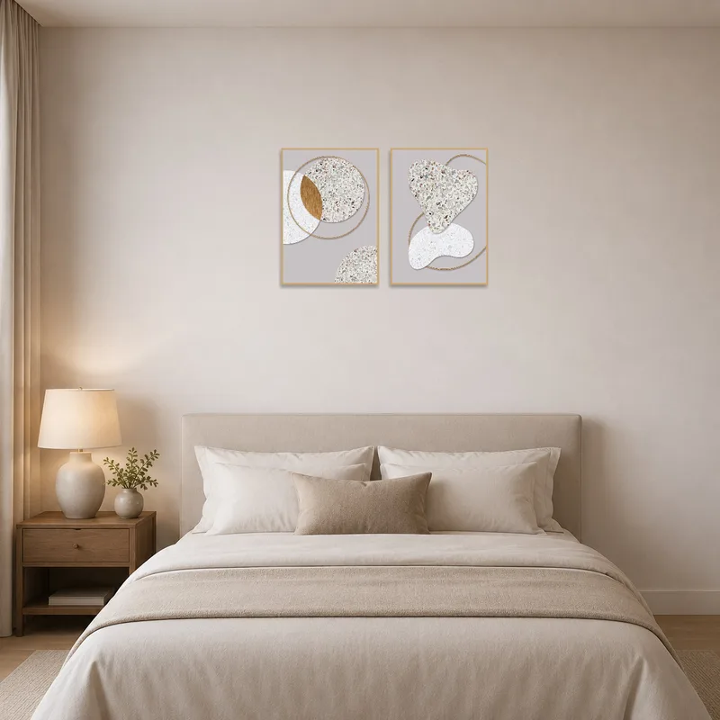 The bedroom's calm atmosphere is uplifted by the terrazzo and gold abstract art.