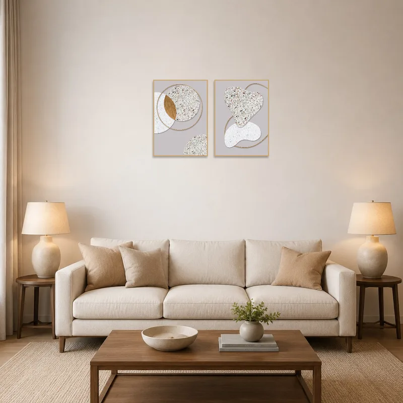 The terrazzo and gold abstract art enhances the modern living room's ambiance.