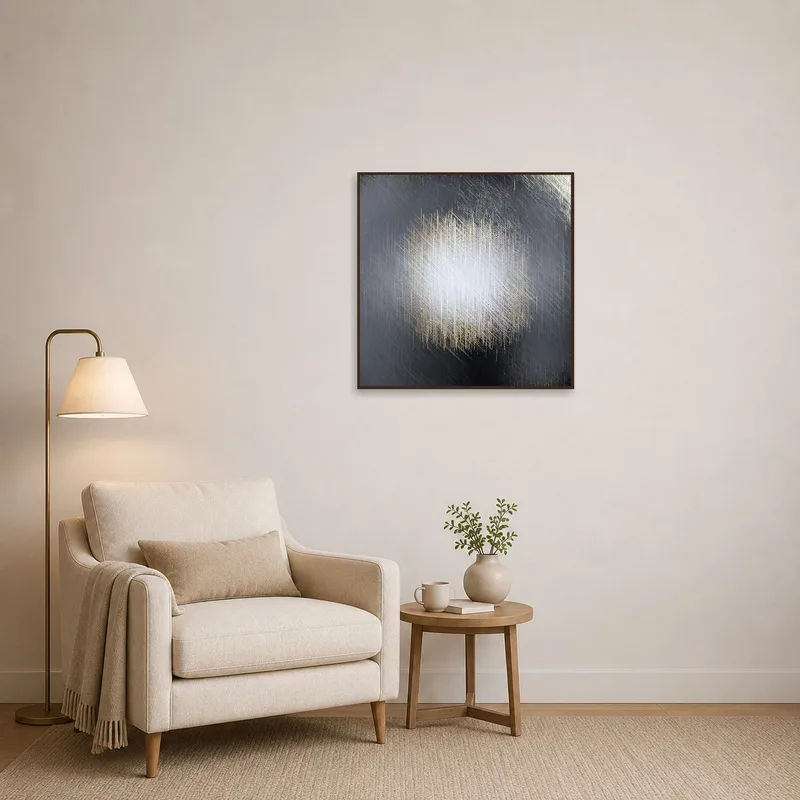 A textural abstract canvas with metallic hues adding depth to a cozy reading corner.