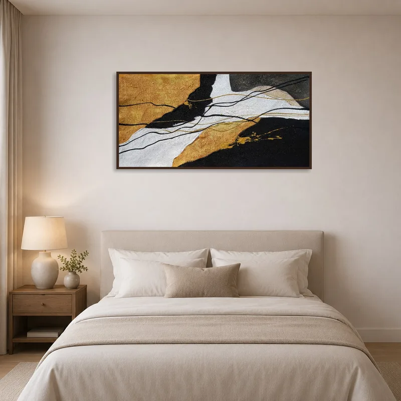 Abstract art with gold highlights featured in a modern bedroom.