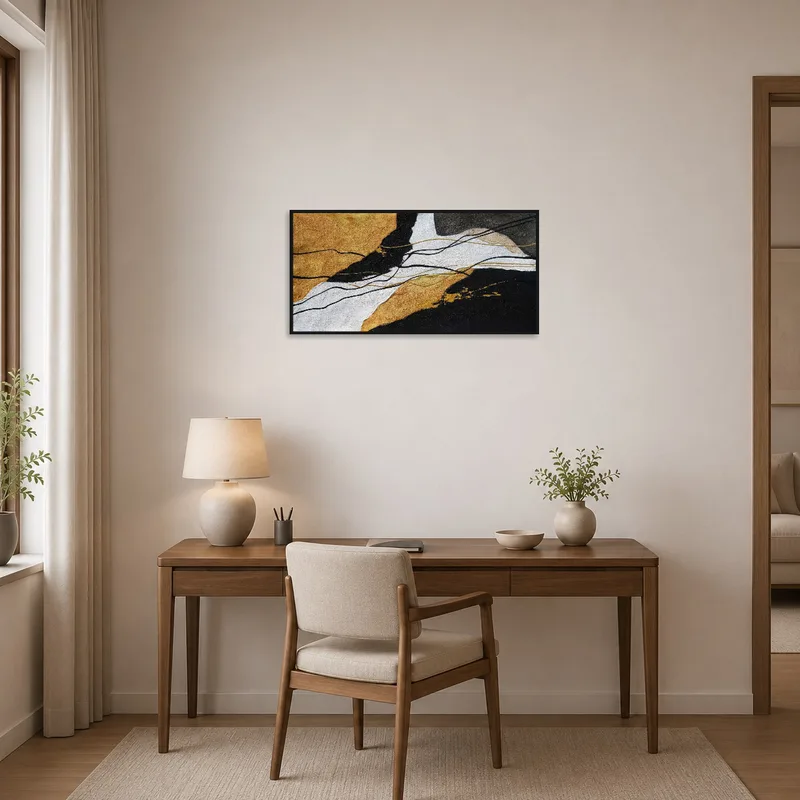 Textured artwork with gold accents in a stylish home office.