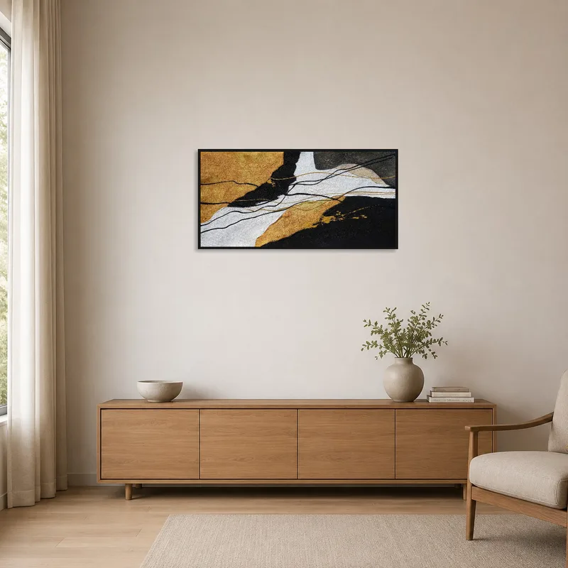 Simple space with abstract artwork featuring gold accents.