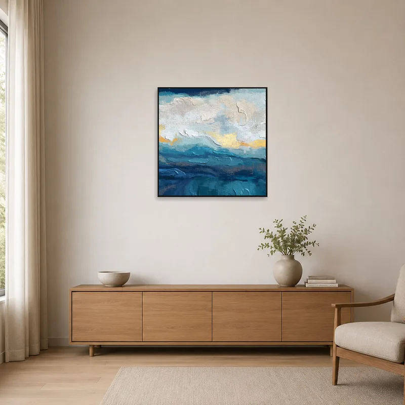 Minimalist room featuring abstract artwork with ocean hues on a simple wall.