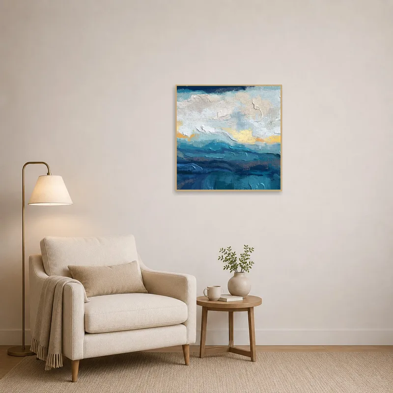 Textured ocean art creates a calming vibe in a cozy reading corner.