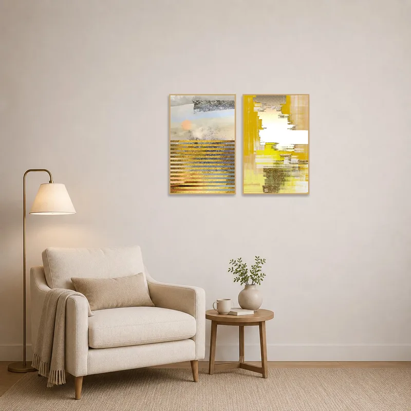 Textured abstracts with gold and earth tones create a cozy atmosphere in a reading corner.