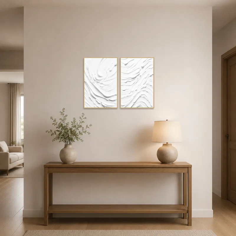 The abstract white set adds style to an entrance-hall with a console.