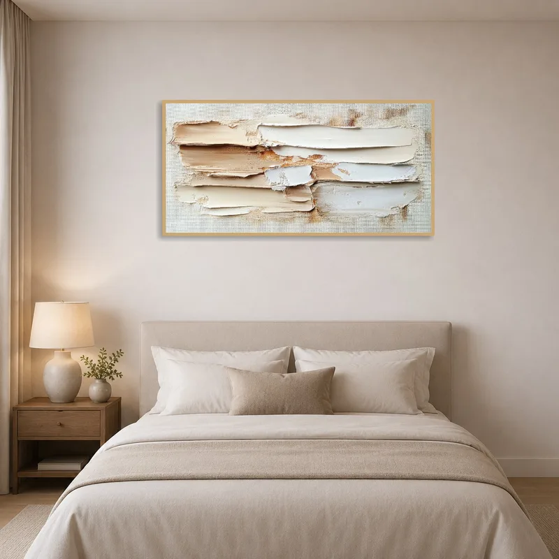 Abstract art piece with textured neutral hues adding serenity to a bedroom.