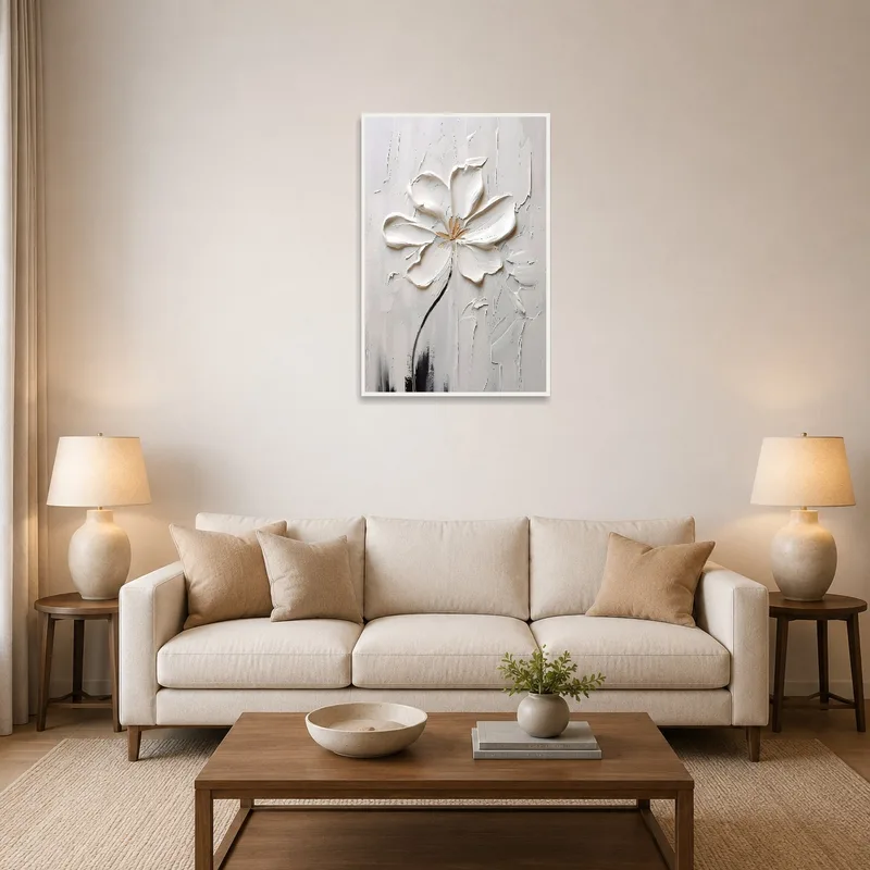 Textured white blossom artwork above a couch in a cozy living room.