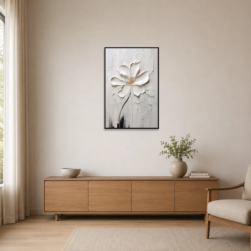 White blossom art on a neutral wall in a minimalist space.