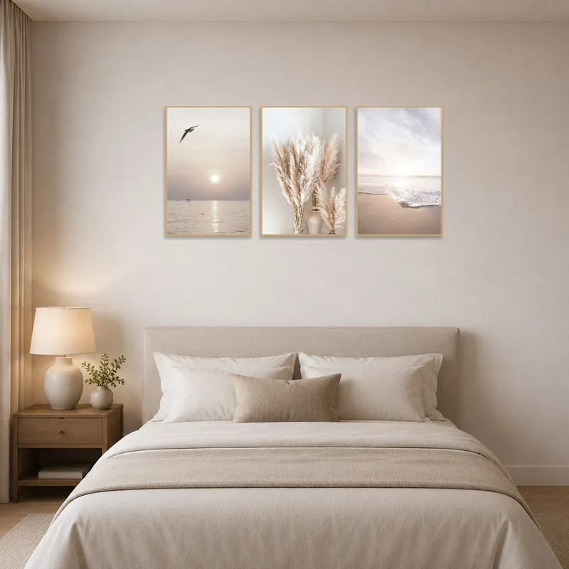Above the bed, the coastal and pampas grass triptych art brings tranquility to the bedroom.