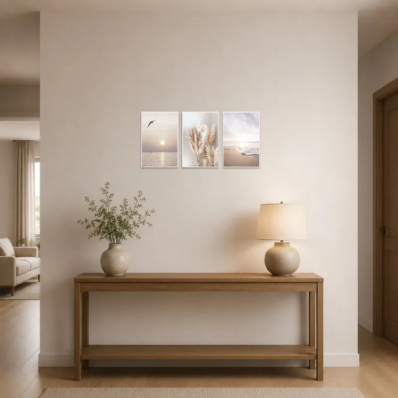 In the entrance hall, the triptych art showcasing beaches and pampas grass greets visitors.