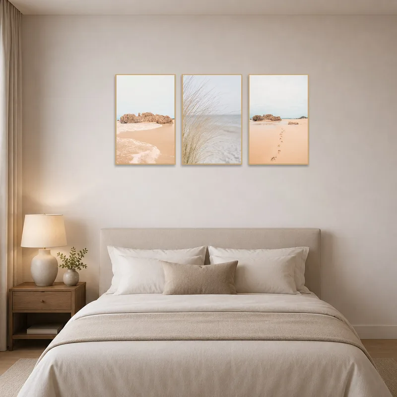 Coastal triptych art set brings serenity to the bedroom wall.