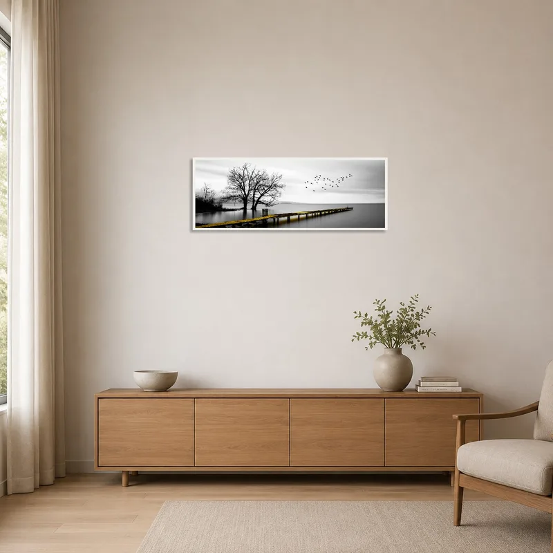 Minimalist space featuring a peaceful lake pier and tree scene.