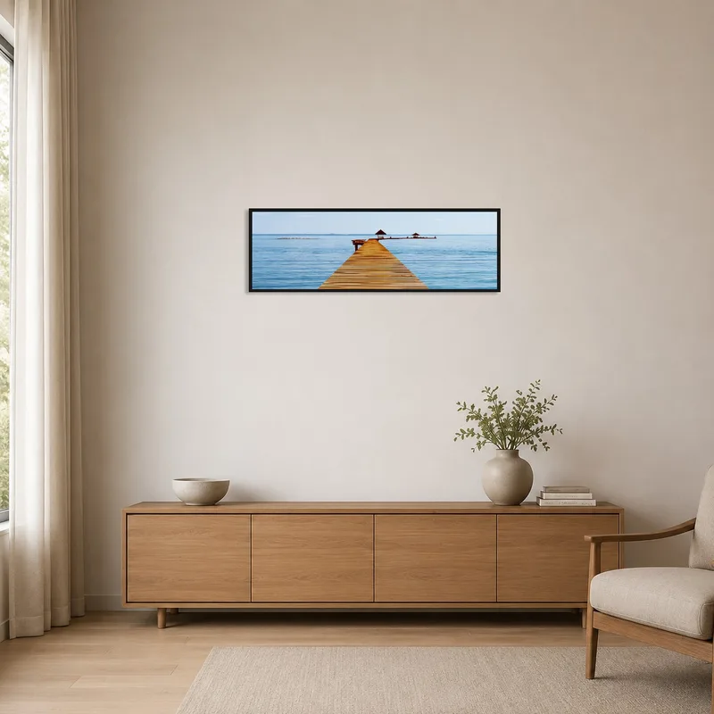 A minimalist room highlights the tranquil pier scene.