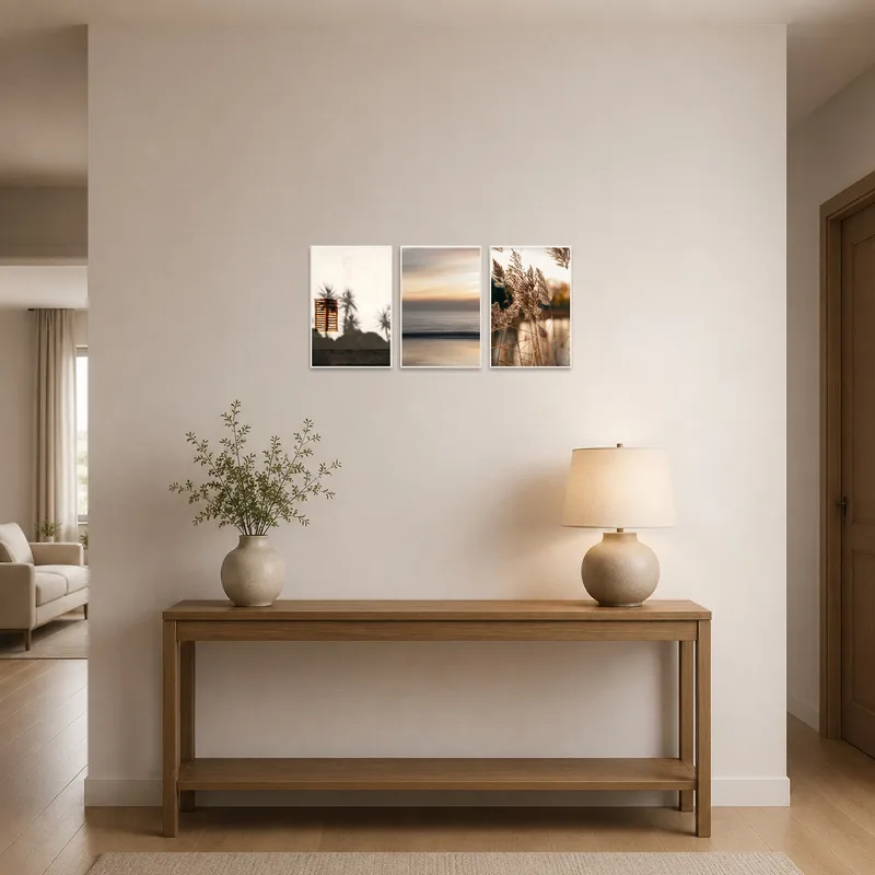 Entrance hall featuring a serene landscapes triptych set above a console table.