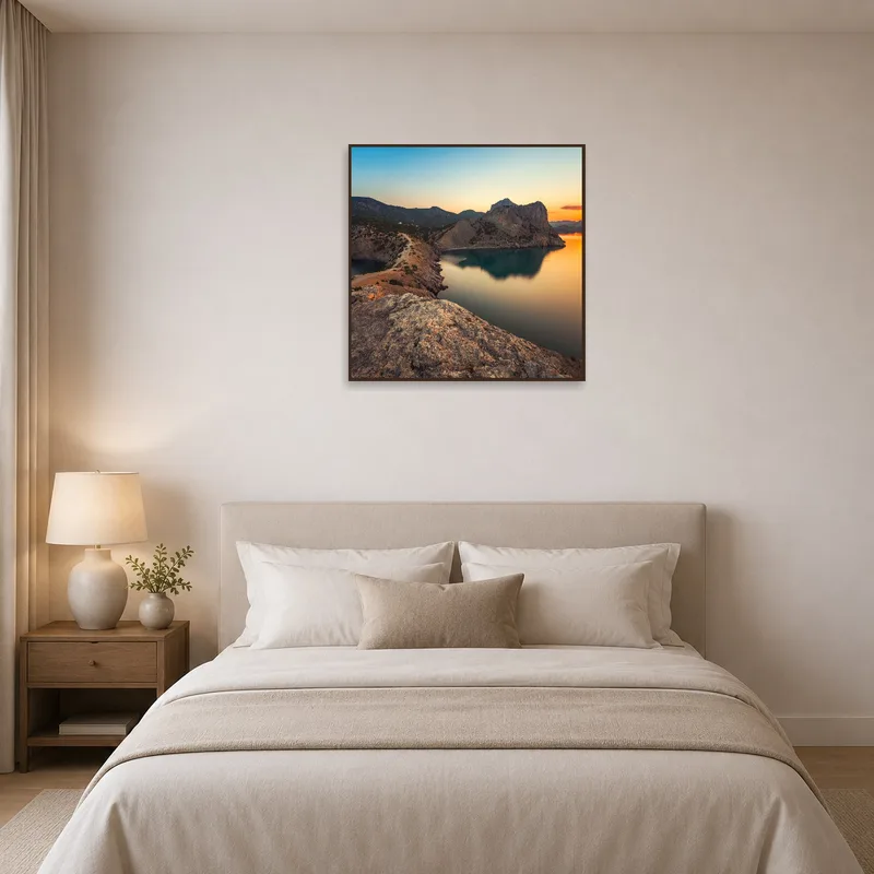 A calming sunset over cliffs offers tranquility and warmth to the bedroom.