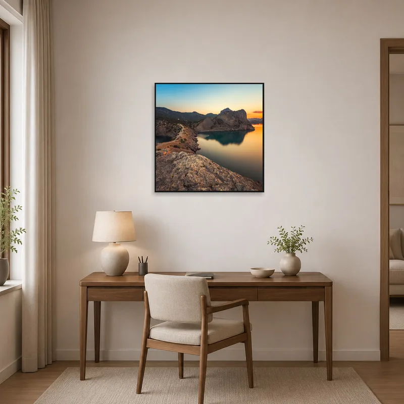 The serene artwork of coastal cliffs adds a relaxing ambiance to the home office.