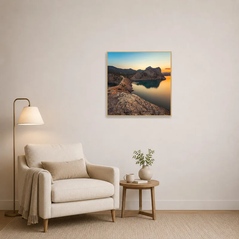 The serene coastal cliffs artwork enhances the peaceful atmosphere of the reading corner.