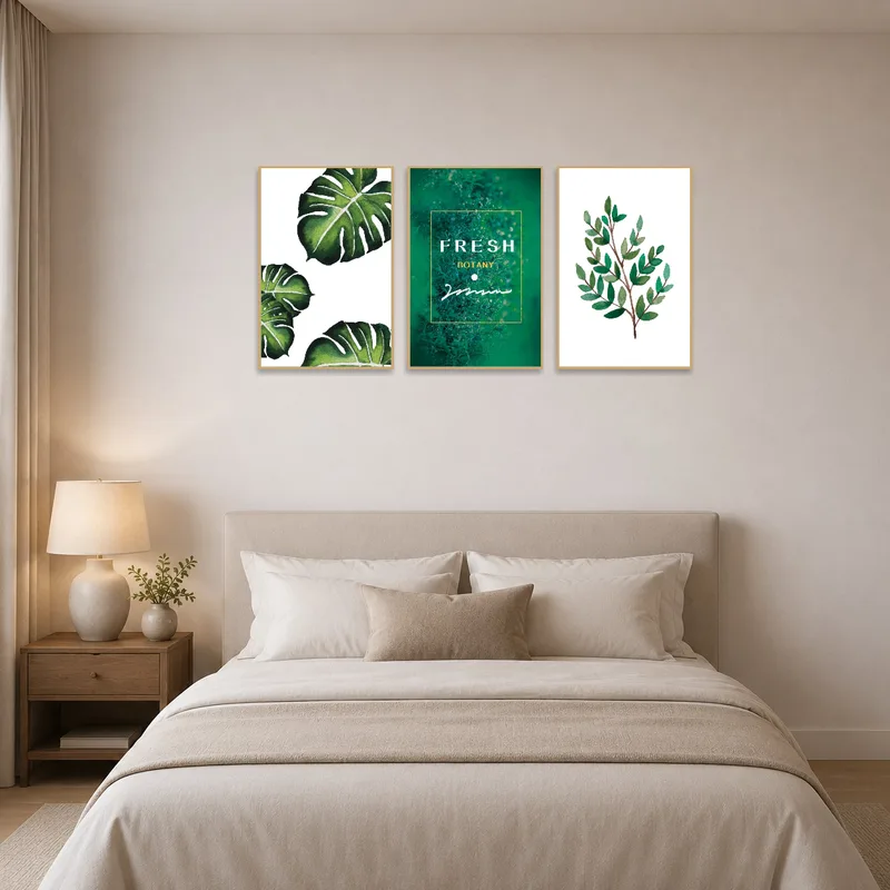 Bedroom accentuated by a tropical botanical art set with lush green leaf designs.