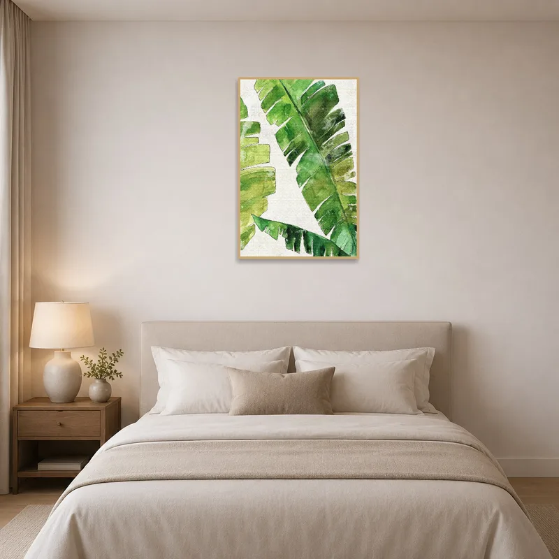Serene bedroom adorned with watercolor art of green banana leaves.