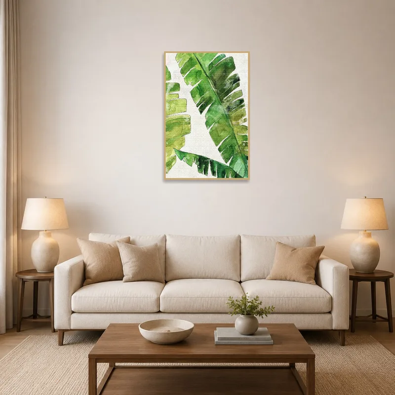 A watercolor art of banana leaves brightens a stylish living room.
