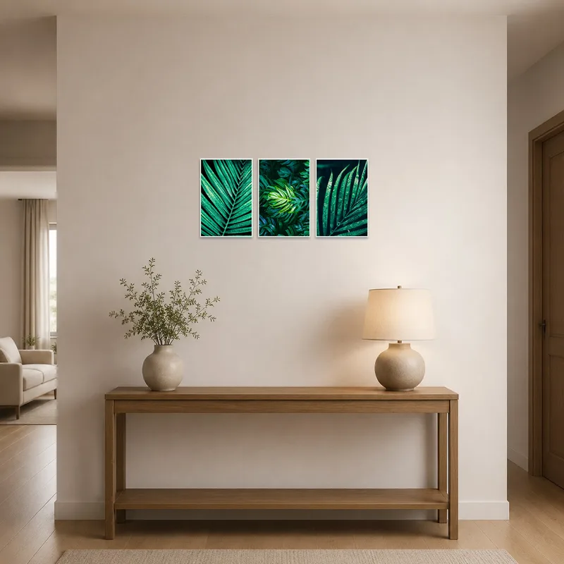 Tropical leaf triptych displayed in an entrance hall, adding vibrant greenery to the space.