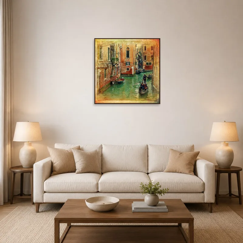 A vintage Venetian canal scene hangs above a cozy living room sofa.