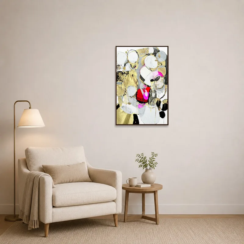 Colorful abstract art with gold elements in a cozy reading corner, enhancing the space's charm.