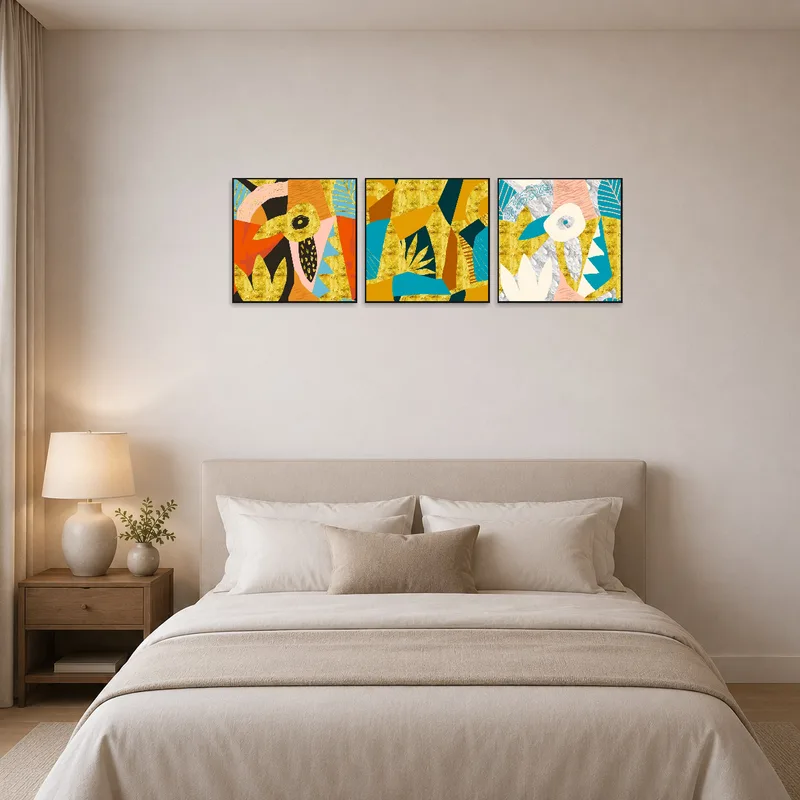 Bold abstract artwork triptych adds energy above a bed in a tranquil bedroom.