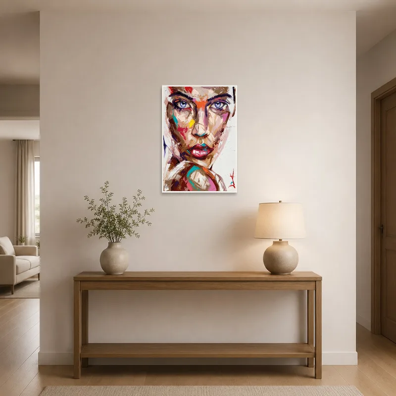 Colorful abstract portrait welcomes visitors in the entrance hall, mounted above a console table.