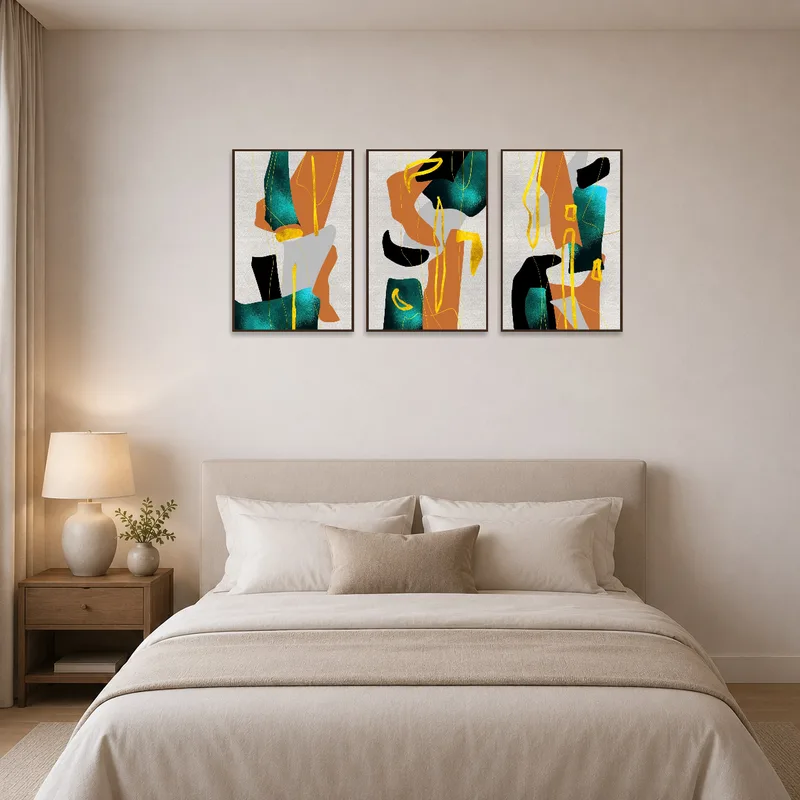 Earthy abstract triptych adds warmth and vibrancy to a bedroom wall above the bed.