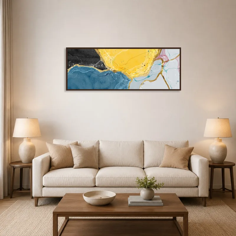 Vibrant abstract artwork with gold accents over a modern sofa in a stylish living room.