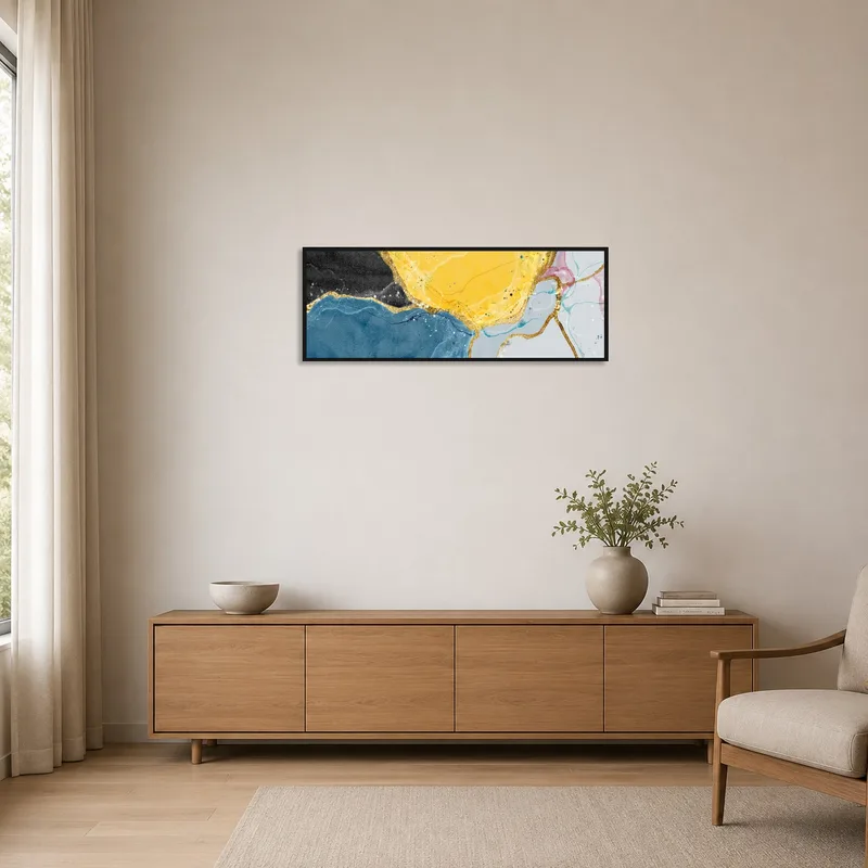 Vibrant gold-accented abstract art adding color to a minimalist room with sparse furnishings.