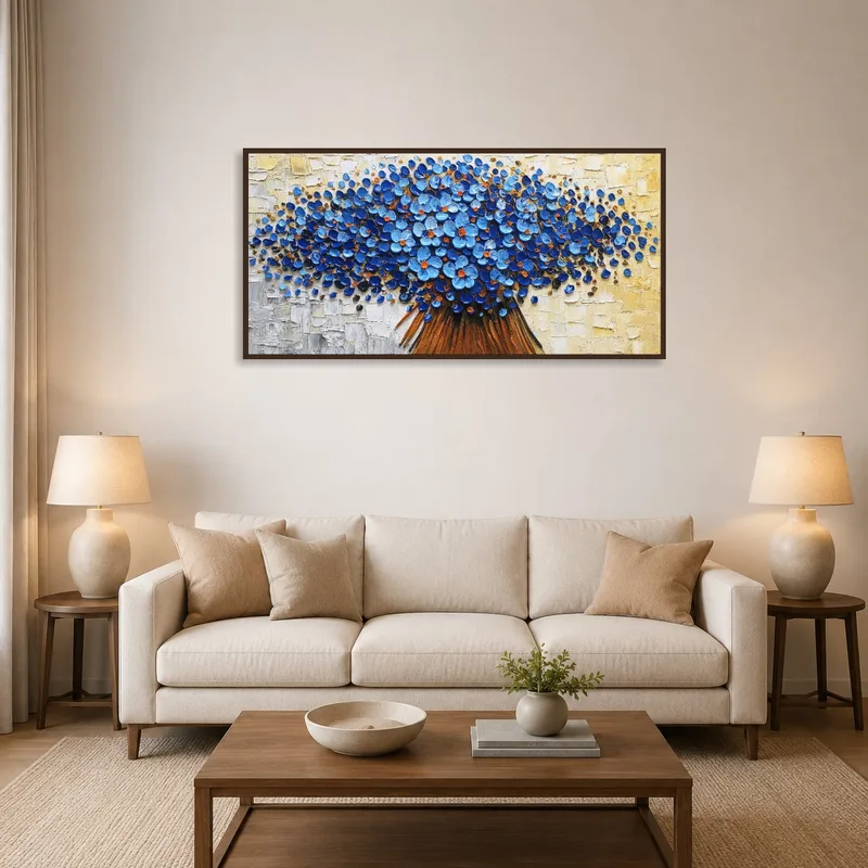 Vibrant blue floral abstract art on a living room wall above a modern sofa.