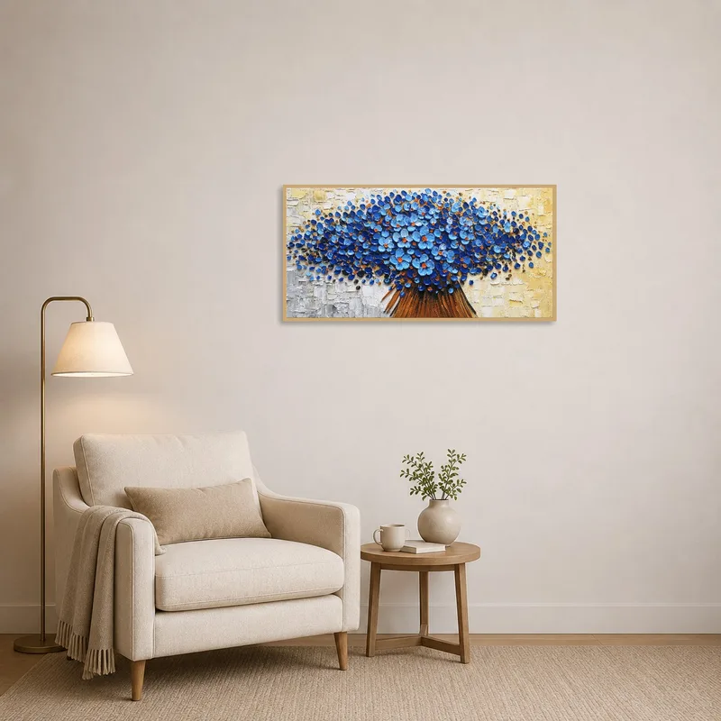 Reading corner features a blue floral abstract piece on the wall beside a comfy chair.