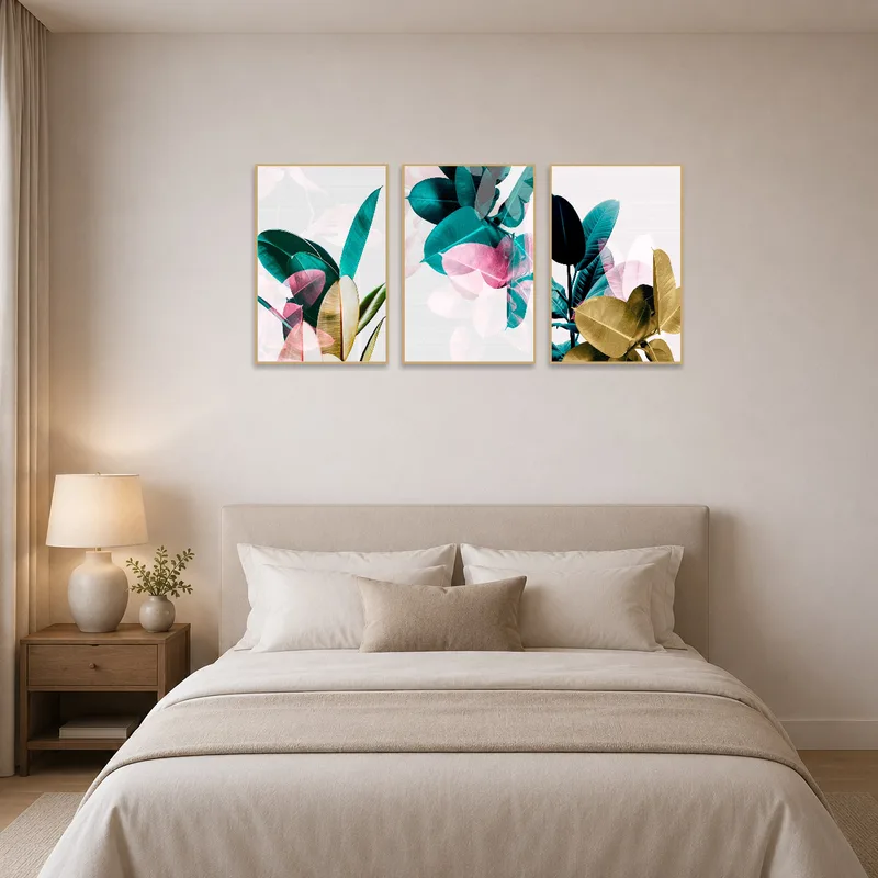 The bedroom wall features a triptych of vibrant tropical leaves.