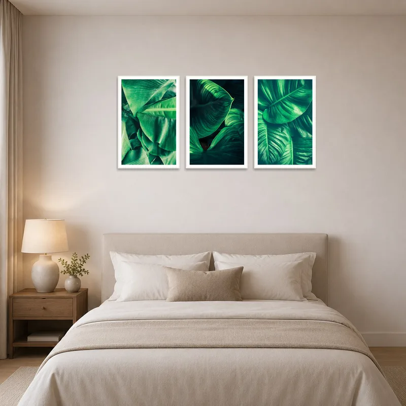 Green foliage triptych bringing nature into a bedroom setting.