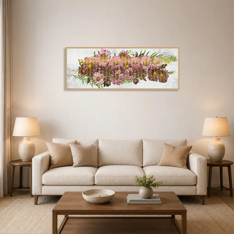 Vibrant pink floral artwork hanging above a modern living room sofa.