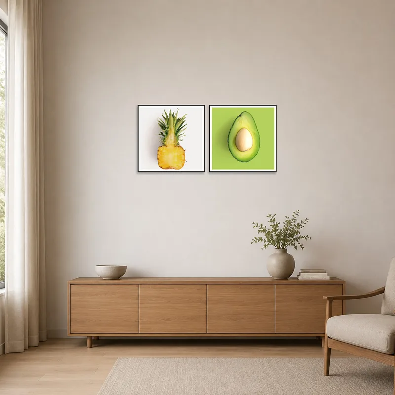 Colorful fruit art pair adding flair to a minimalist room's clean lines.
