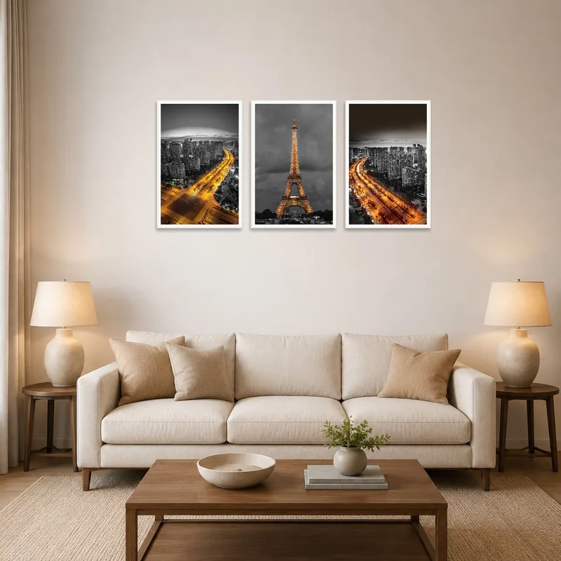 Monotone cityscapes triptych adorning a modern living room wall.